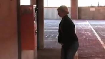 Female urinating in the parking area