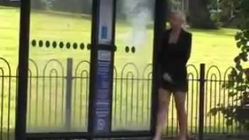 Young girl urinating at the bus stop