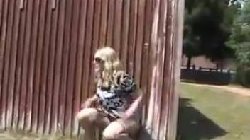 Urinating female by the barrier