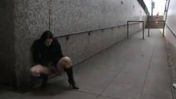 Girl peeing in the subway tunnel